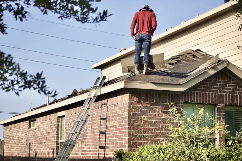 Professional roofer working on a residential roof in Marietta